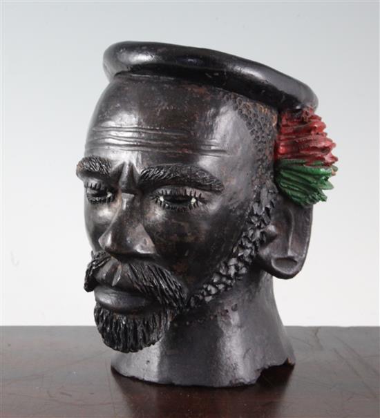 An African painted terracotta jar modelled as the head of a bearded man, 7.5in.